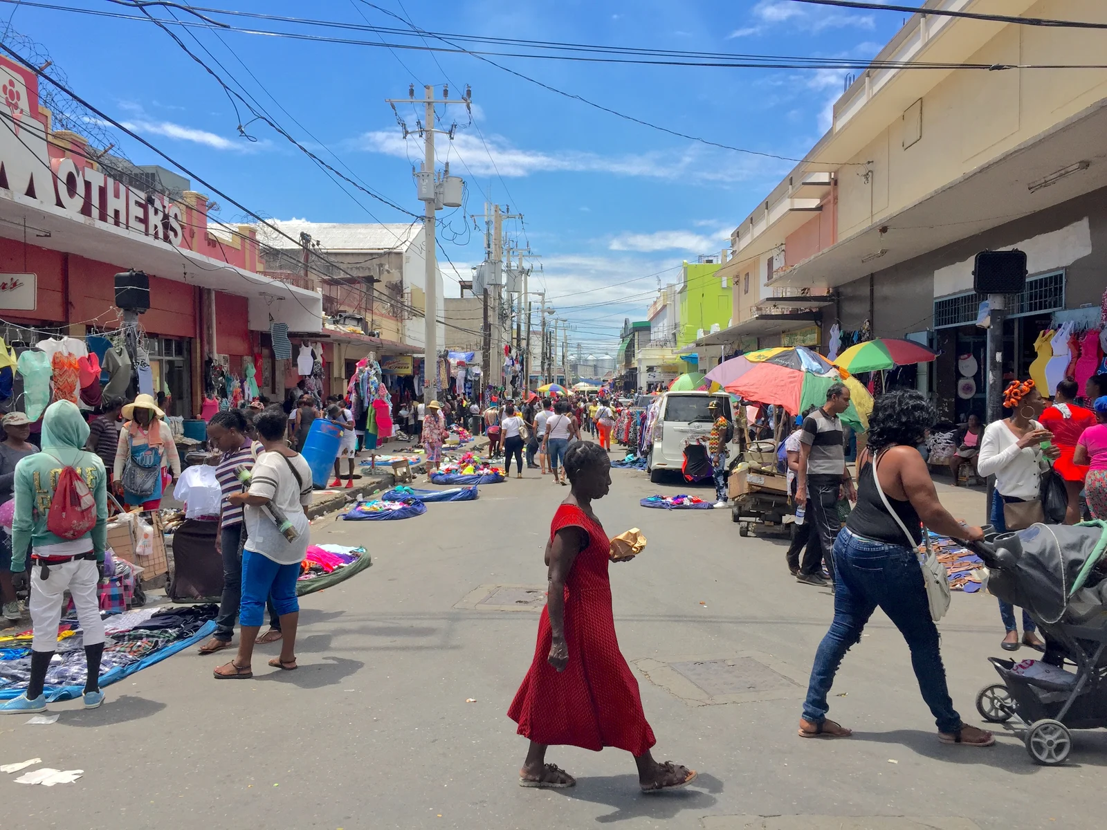 Market in Kingston with people walking about for a piece on the best time to visit Jamaica