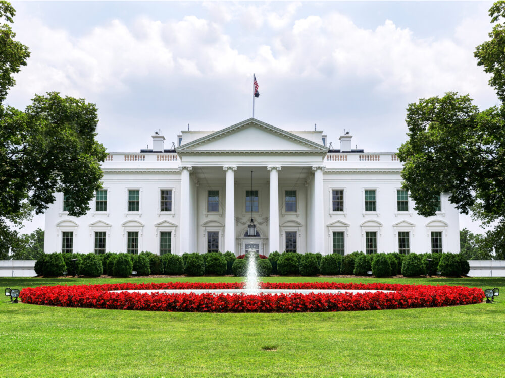The White House, with an intricate landscape and mowed grass, listed as one of the best things to do in Washington, D.C.