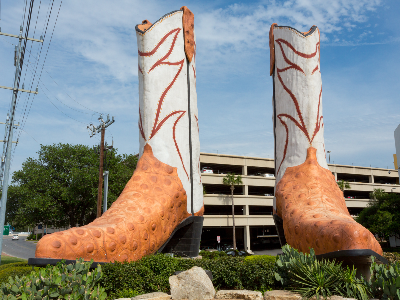 Image of giant cowboy boots outside the North Star Mall for a piece titled Is San Antonio Safe