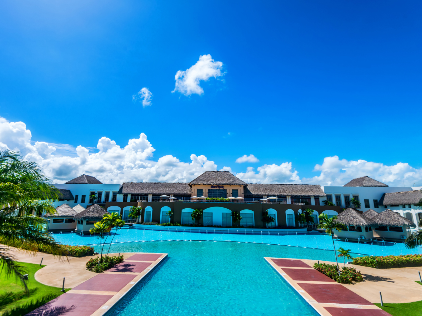A bright day over the vast pool area at Hard Rock Hotel and Casino Punta Cana, one of the best all-inclusive resorts in Punta Cana