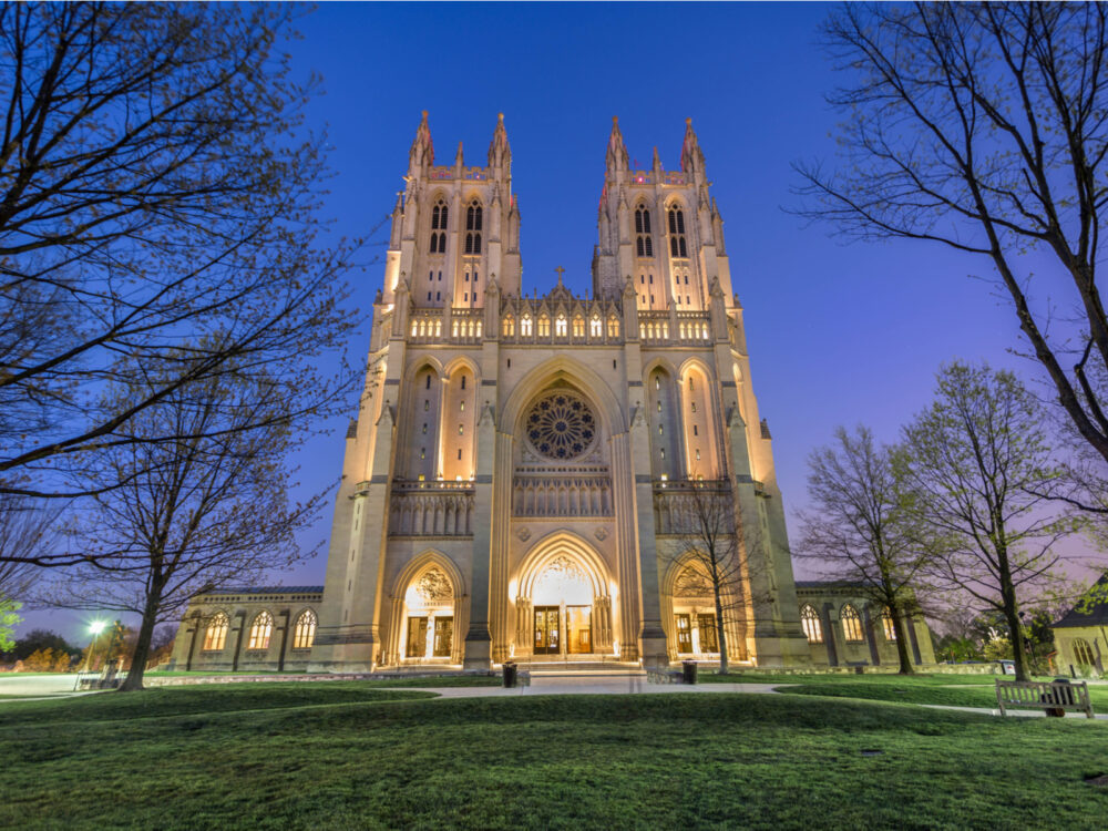 One of the best things to do in Washington, D.C. is visit the historical Washington Cathedral, pictured in fall during dusk time