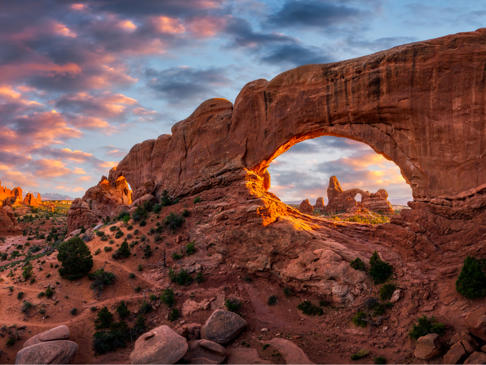 Evening light over the red rocks of Turret Arch during the best time to visit Utah