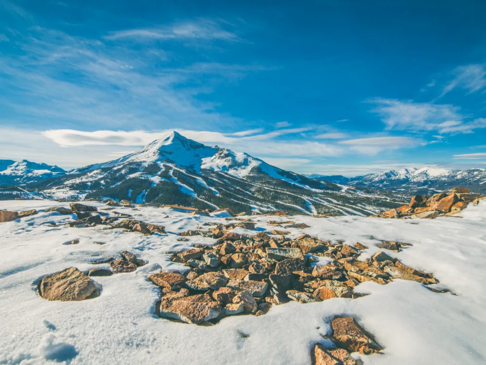 For a piece on the best time to visit Montana, Big Sky pictured with snow on the ground in the mountains