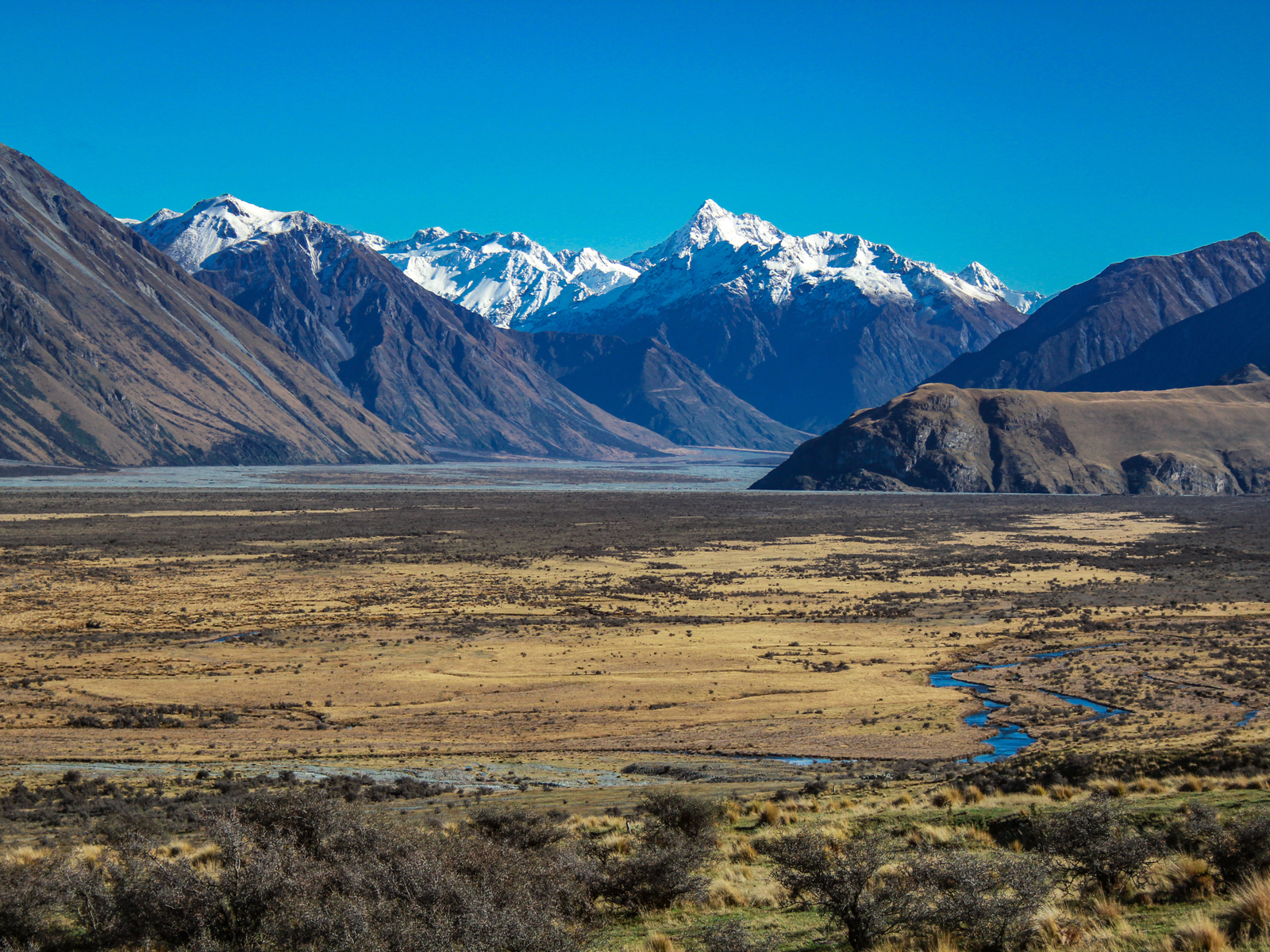 Scenic view on one of Lord of the Rings filming locations, Mount Sunday's icy peaks in Hakatere Conservation Park during a clear day