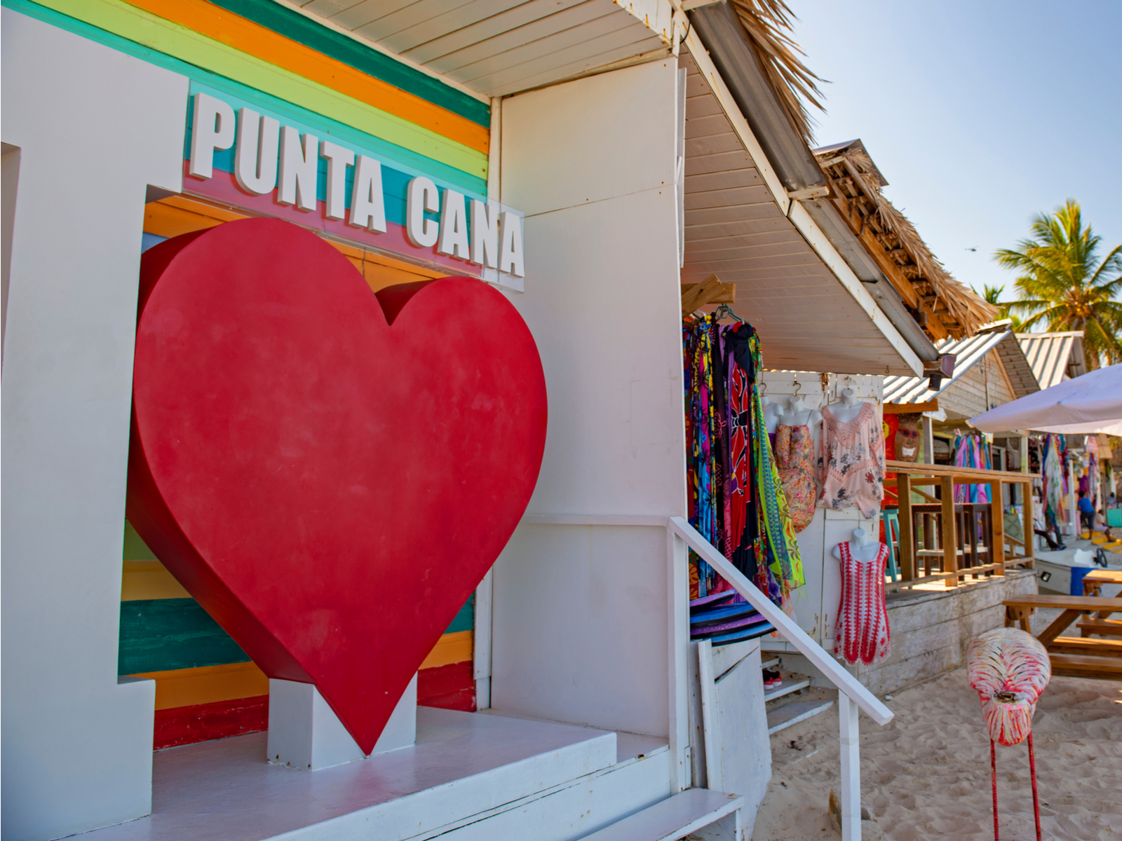 Gift shop with a rainbow exterior and a big red heart sculpture for a piece on the best time to visit Punta Cana