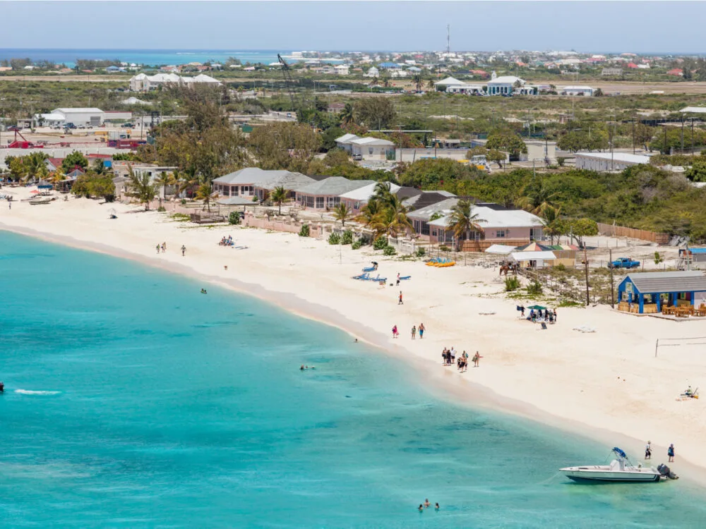 Aerial view of the town and beach of Cockburn, one of our picks when considering where to stay in Turks and Caicos