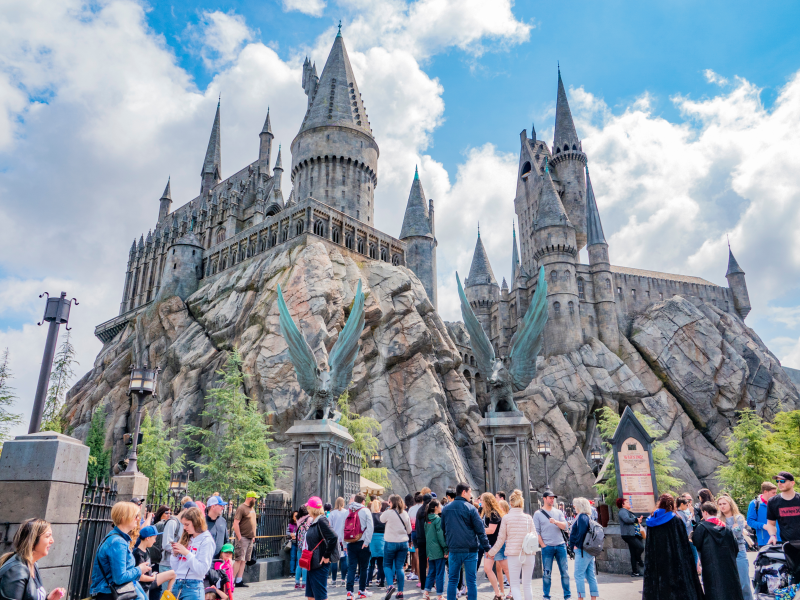 People crowding the entrance of Hogwarts Castle, a Harry Potter Castle theme, at Universal Studios in Hollywood, one of the best things to do in California