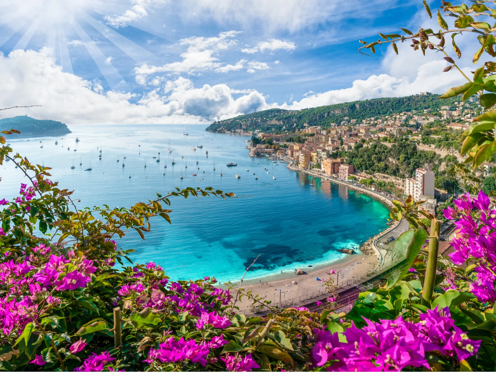 Hilltop view of French Riviera coast with Villefranche sur Mer pictured during the best time to visit France