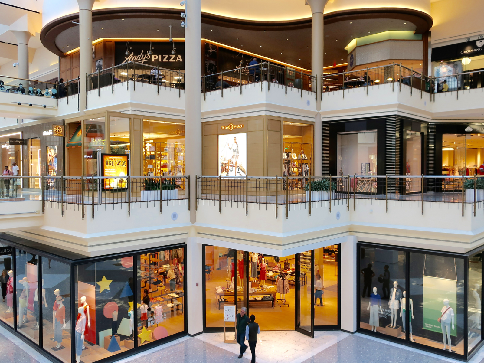 The beautiful interior of Tysons Corner Center in Virginia, where well-lit clothing stores and restaurants are photographed as a piece on the best malls in America