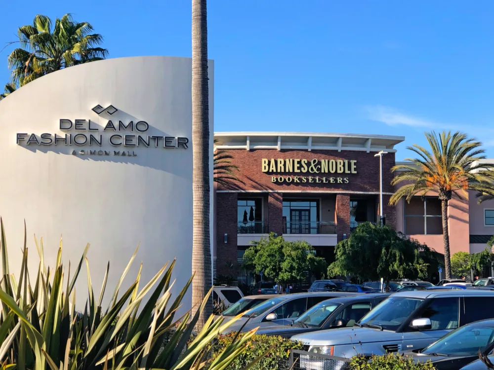 The exterior of Barnes and Nobles with parked cars, located inside Del Amo Fashion Center in California, one of the best malls in America