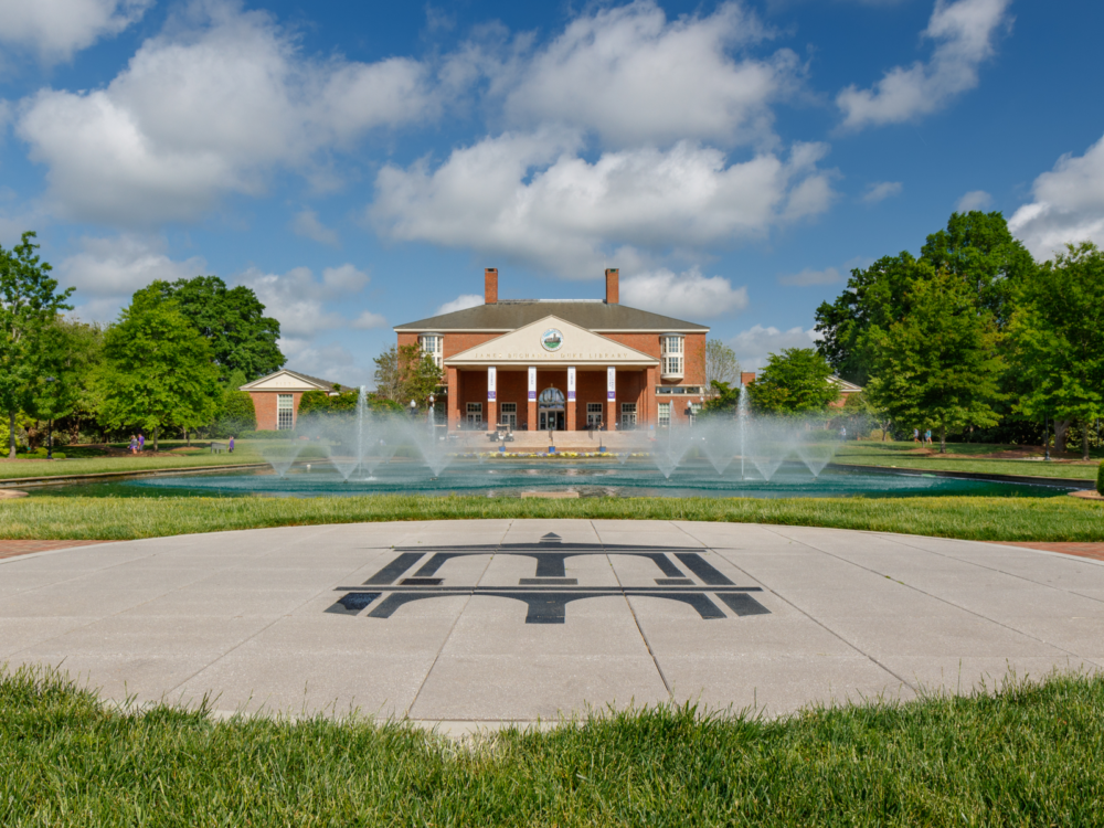 A larg pond fountain with multiple water spouters in front of James B. Duke Library at Furman University in South Carolina, one of the most beautiful college campuses