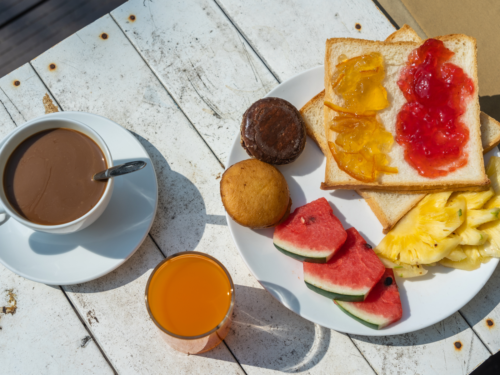 A breakfast serving at the Manatee Palms in Florida, one of the best all-inclusive resorts in the U.S., with watermelon, pineapple, bread with jam, juice and coffee 