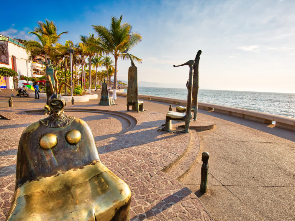 Famous metal sculptures on the boardwalk during the cheapest time to visit Puerto Vallarta