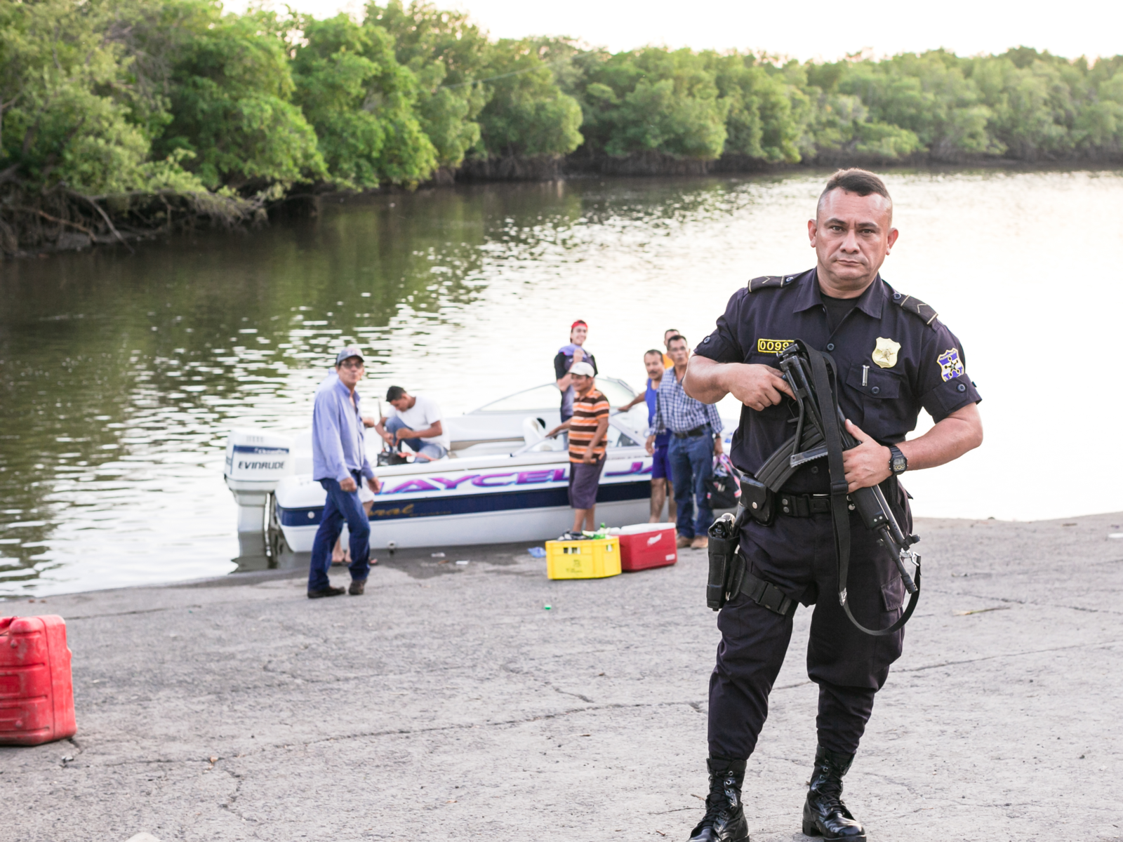 Guy in a police uniform for a piece titled Is El Salvador Safe