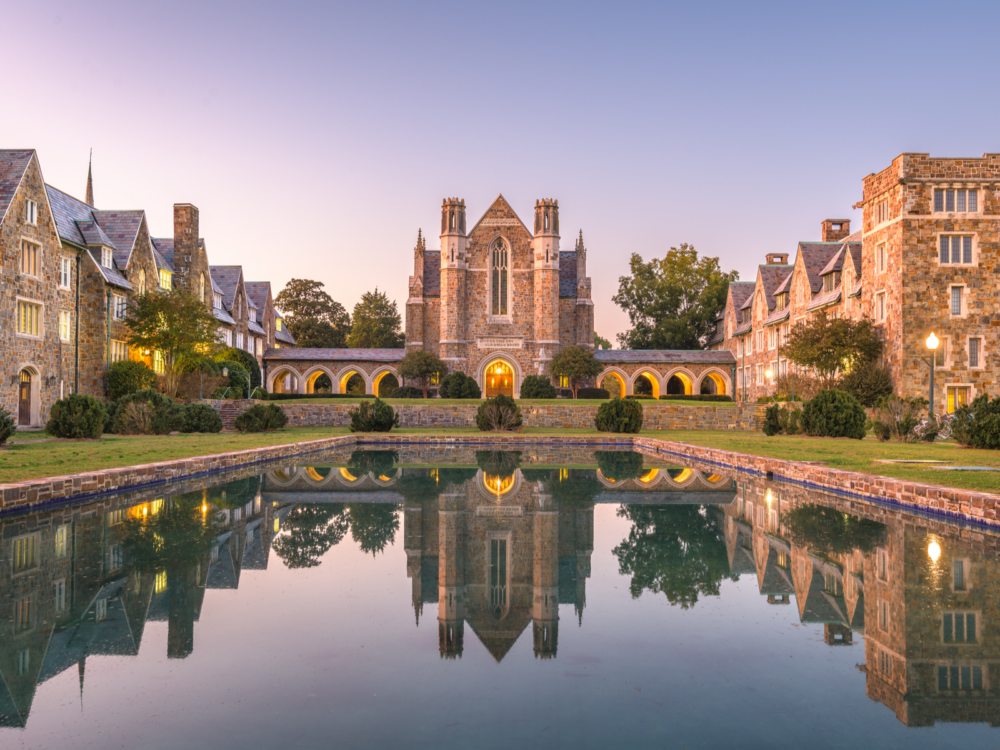 A historic building in Berry College in Georgia, one of the most beautiful college campuses, reflected on the reflection pool at twilight