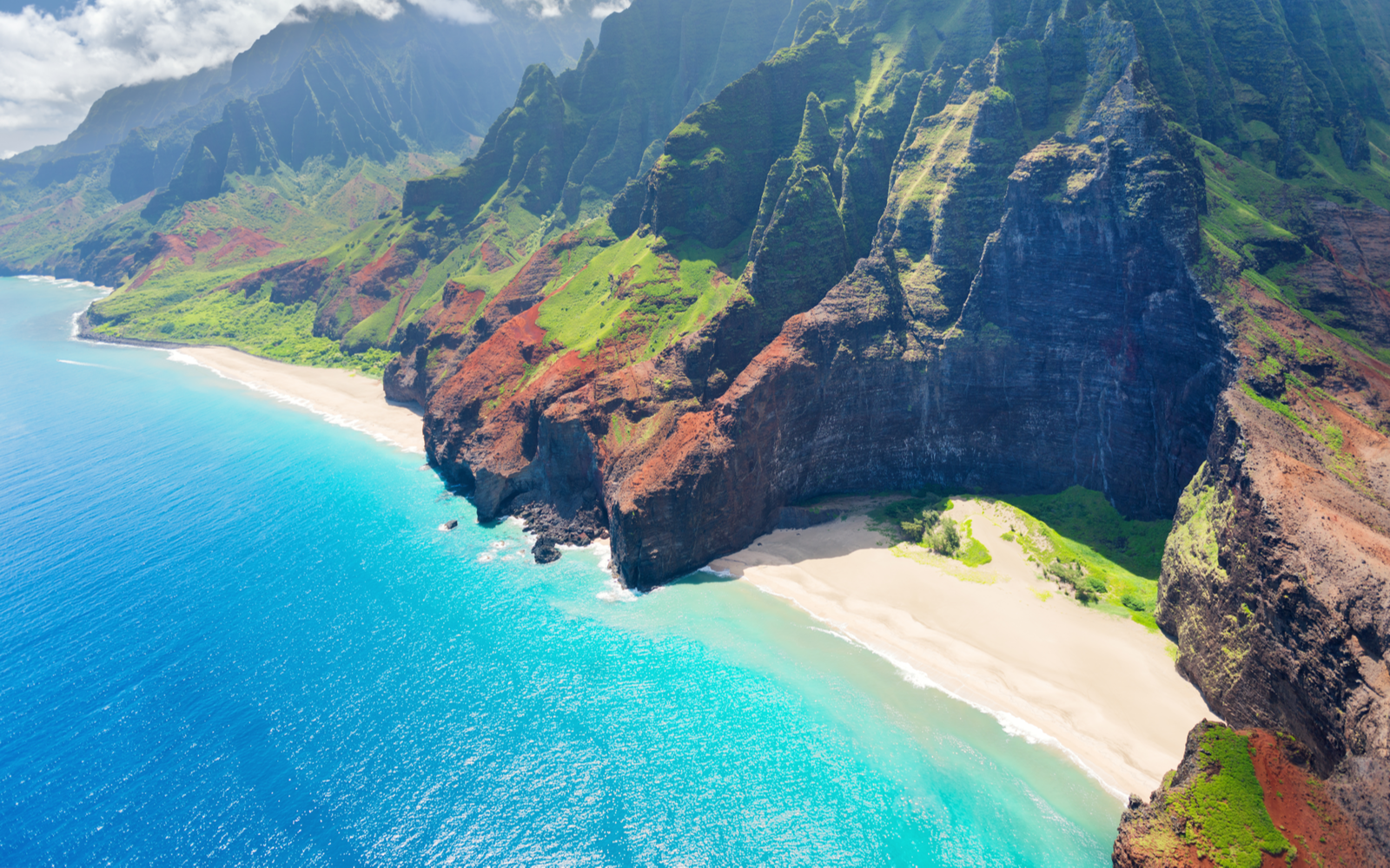 Aerial shot of the Na Pali Coast, home to some of the best beaches in Kauai