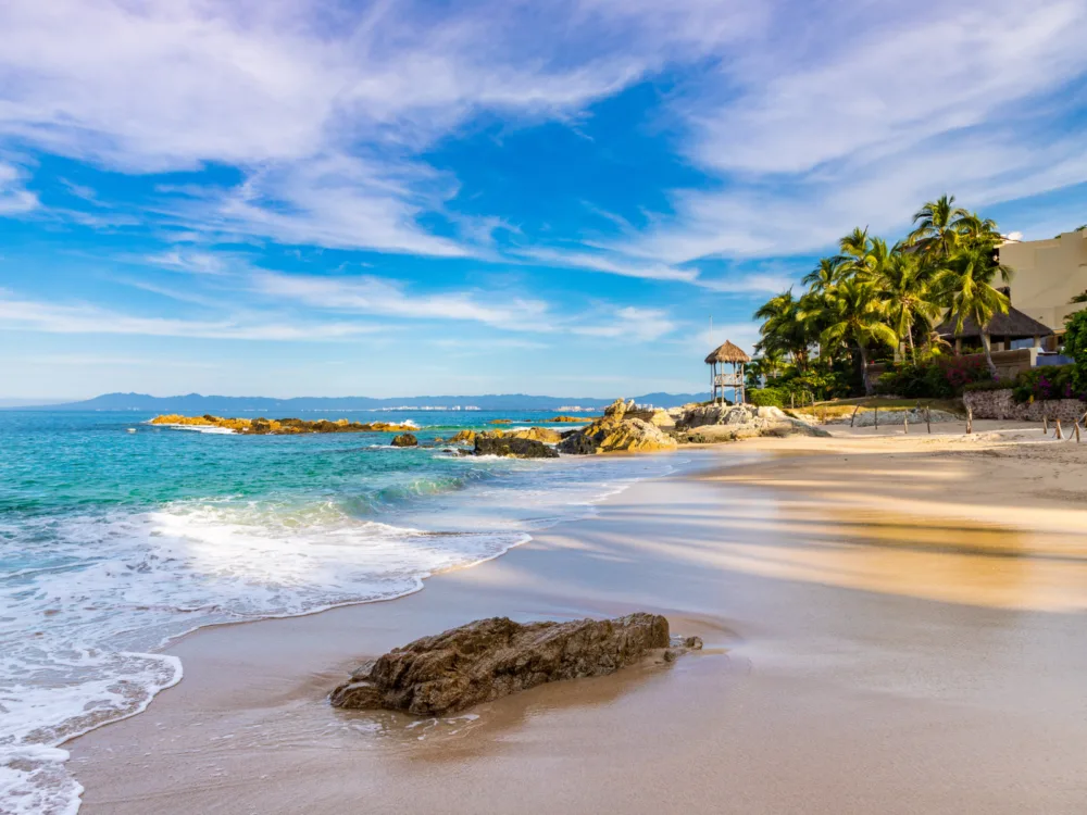 To help answer the question is Puerto Vallarta Safe, the Conchas Chinas beach pictured on a sunny day