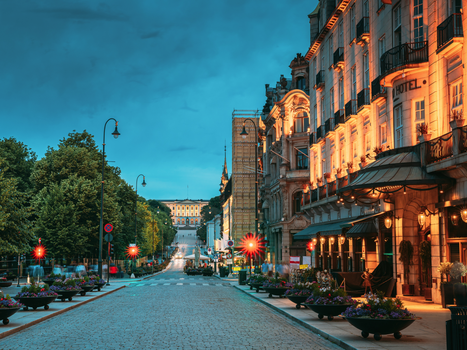 Old town Oslo pictured at night with lighted buildings during the least busy time to visit Norway