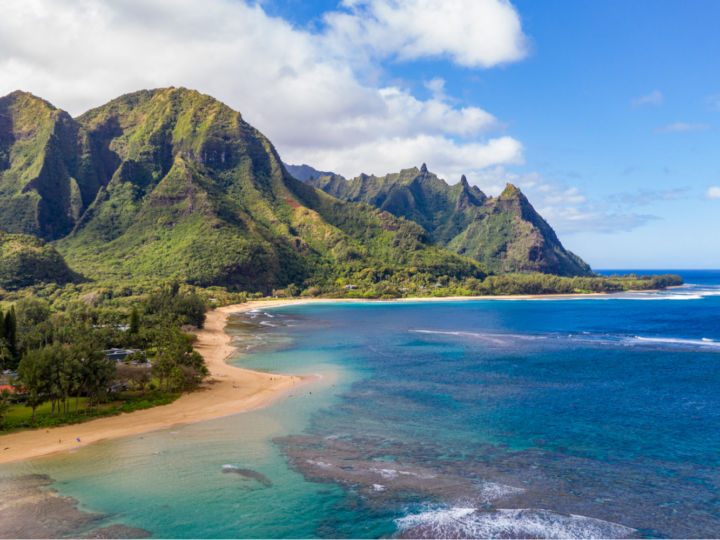 Aerial shot over the Tunnels beach on a clear day for a piece titled the Best Things to Do in Kauai