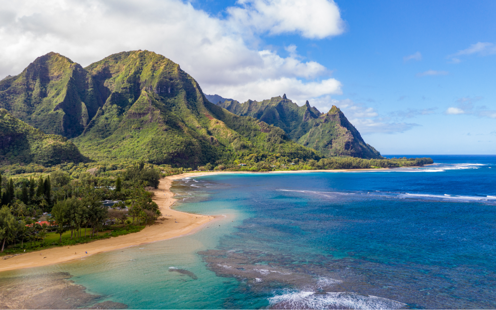 Aerial shot over the Tunnels beach on a clear day for a piece titled the Best Things to Do in Kauai