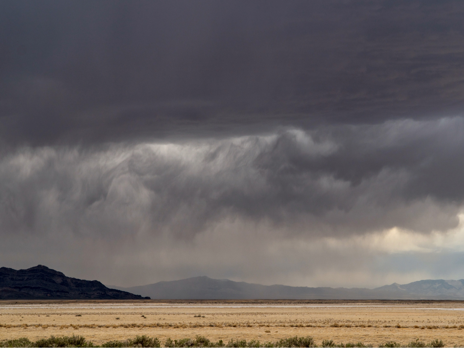 Storm with rain over the plains during the worst time to visit Utah
