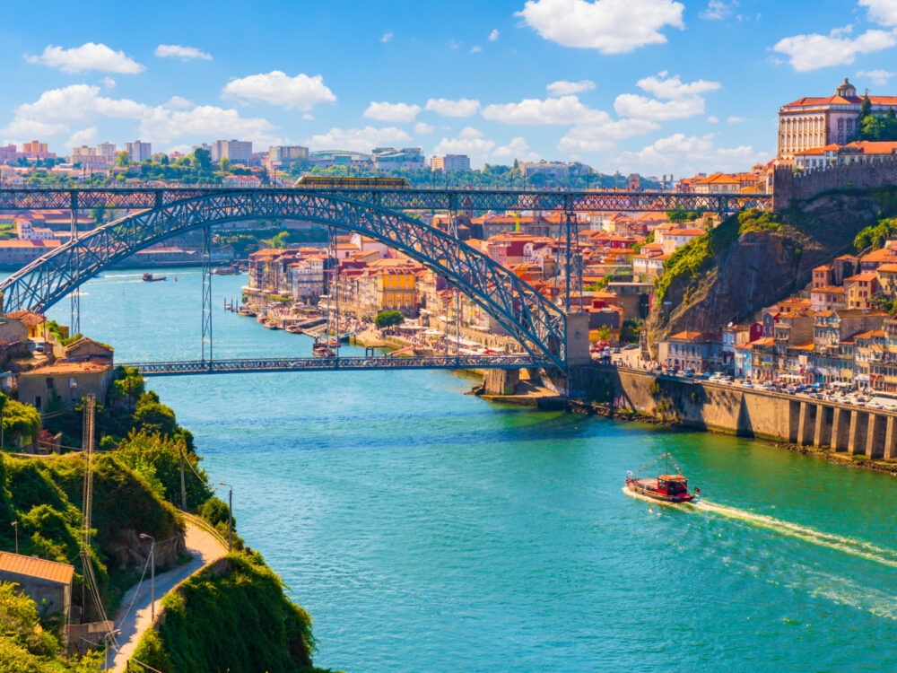 For a piece on the best time to visit Portugal, a bridge in a picturesque photo in old town Porto