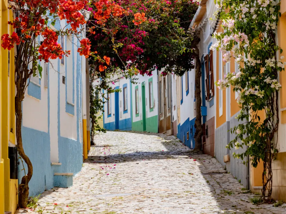 Narrow alleyways in Ferragudo, Algarve during the least busy time to visit Portugal