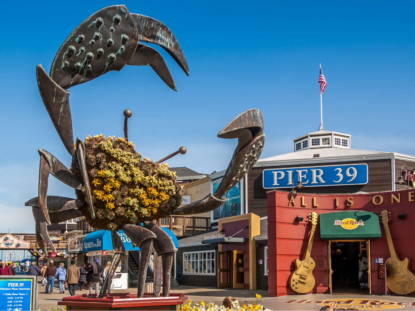 Image of a giant crab sculpture at the Fisherman's Wharf at Pier 39 during the best time to visit San Francisco with blue skies