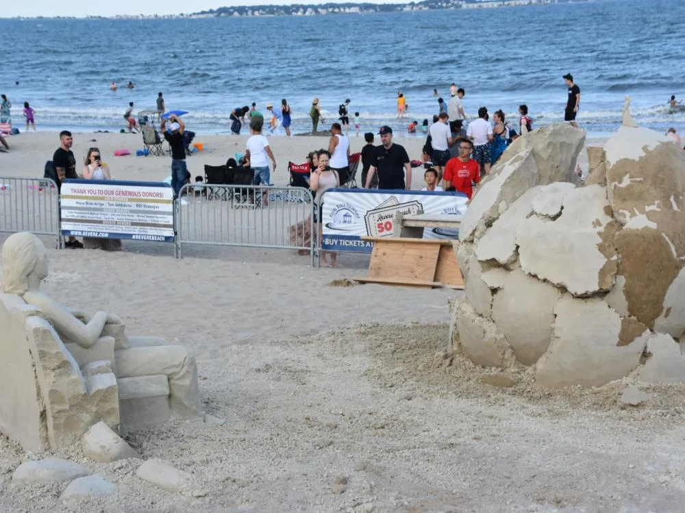 People taking picture of the sand sculptures at Revere Beach in Massachusetts, famed as one of the best beaches on the East Coast, during the International Sand Sculpting Festival