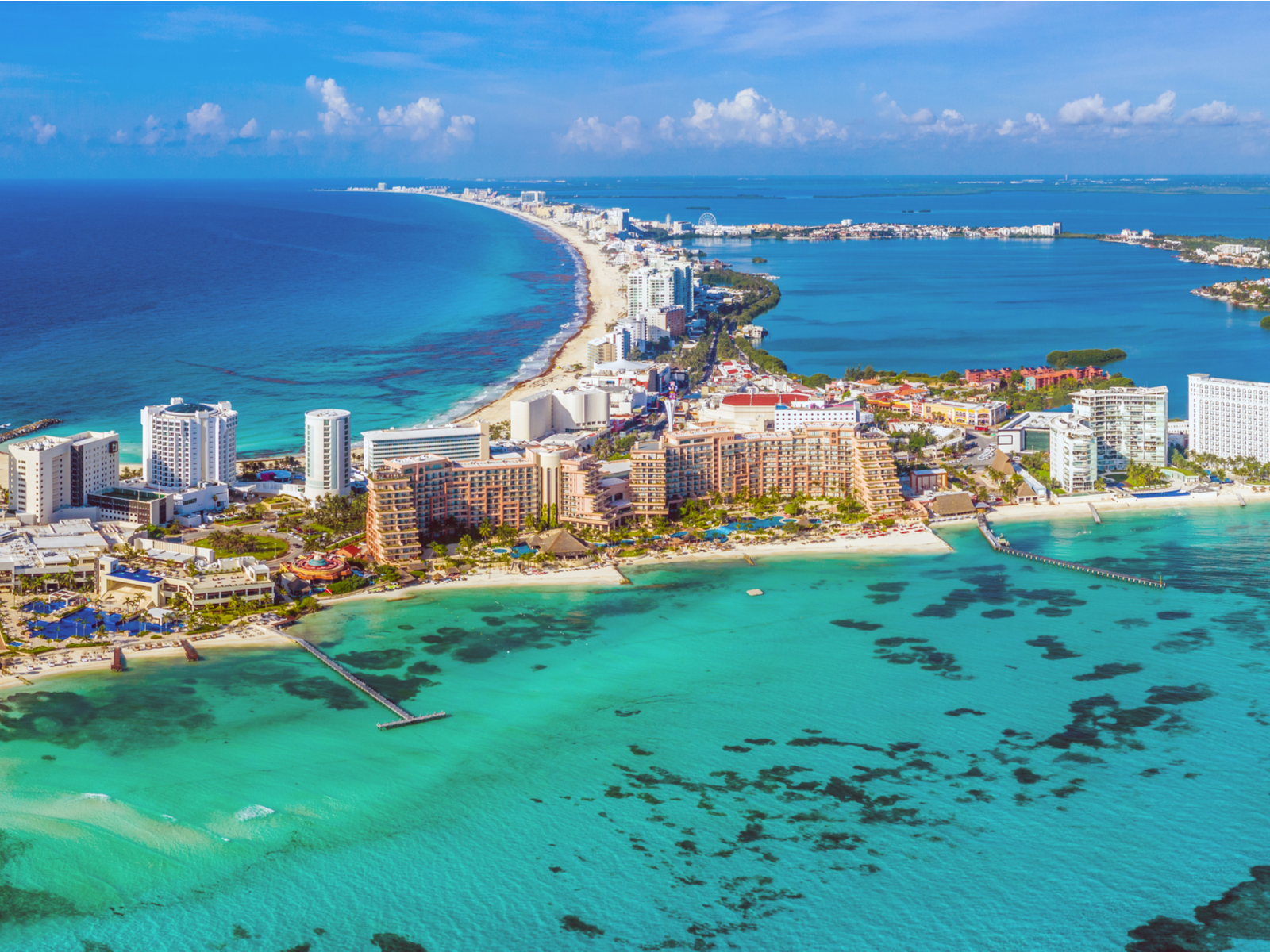 Aerial view on the luxurious emerald waters at Grand Fiesta Americana Coral Beach and its grand buildings, considered as one of the best all-inclusive resorts in Cancun for families
