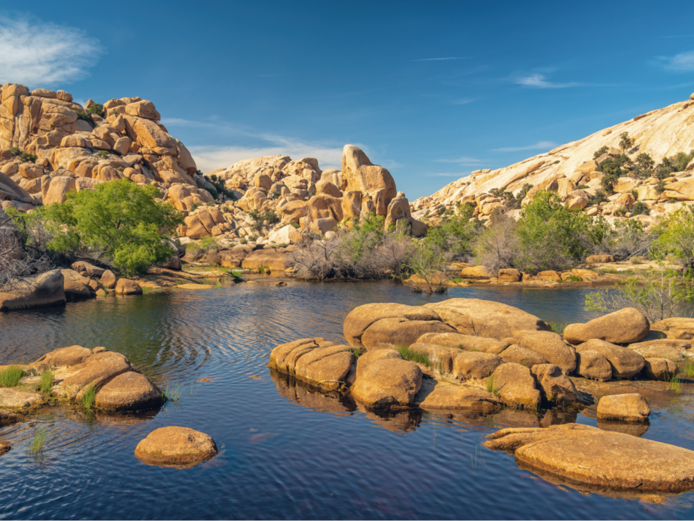 Water below rocks and a canyon above Baker Dam in Joshua Tree National park