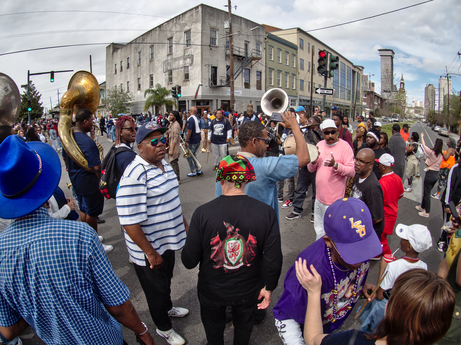 People attending a parade in the street for a piece titled Is New Orleans Safe