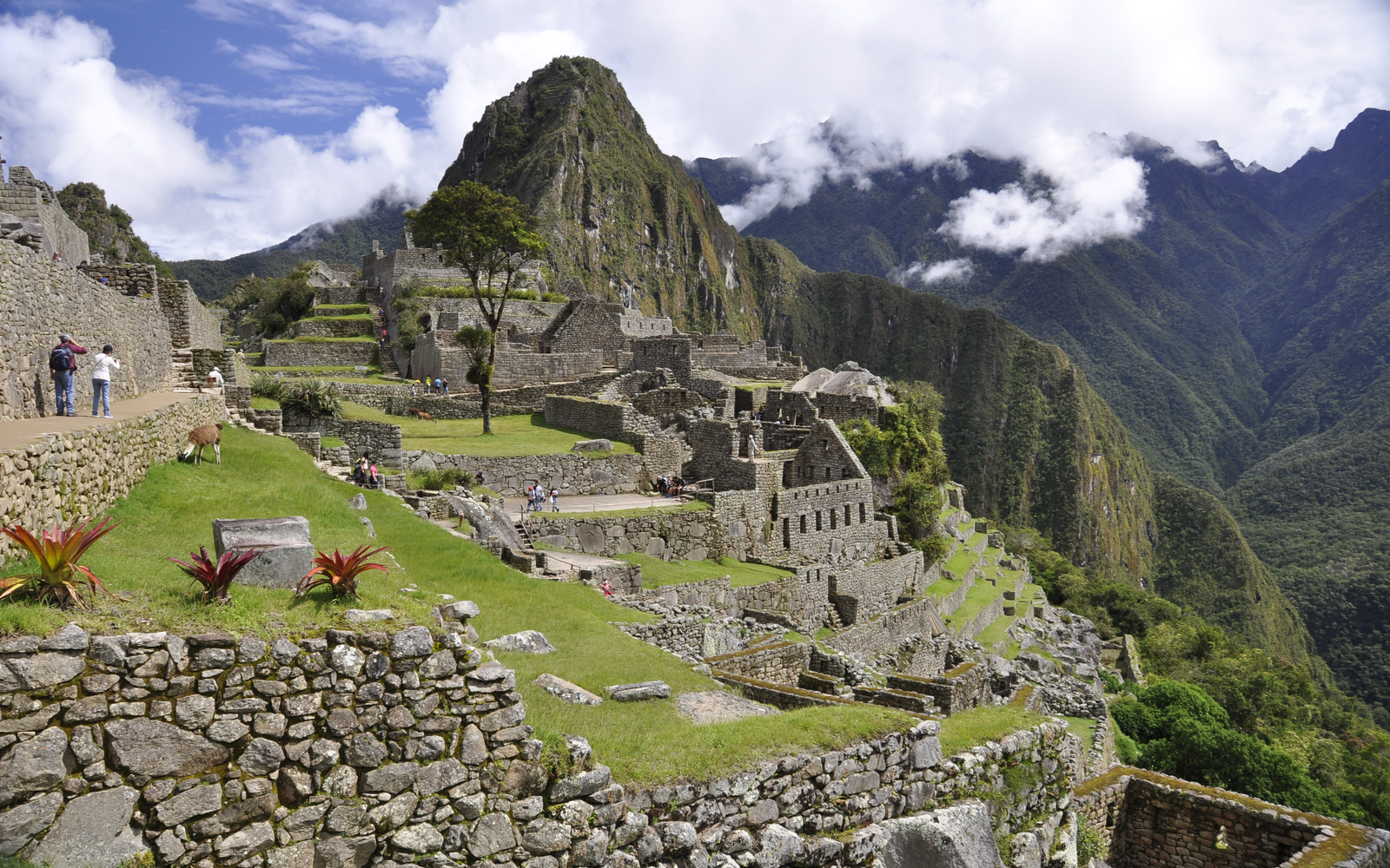 For a piece titled The Best Time to Visit Peru, Machu Picchu sits under some clouds on an otherwise nice day