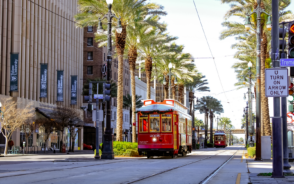 Trolley rolling down St. Charles Ave for a featured image for a piece titled Is New Orleans Safe