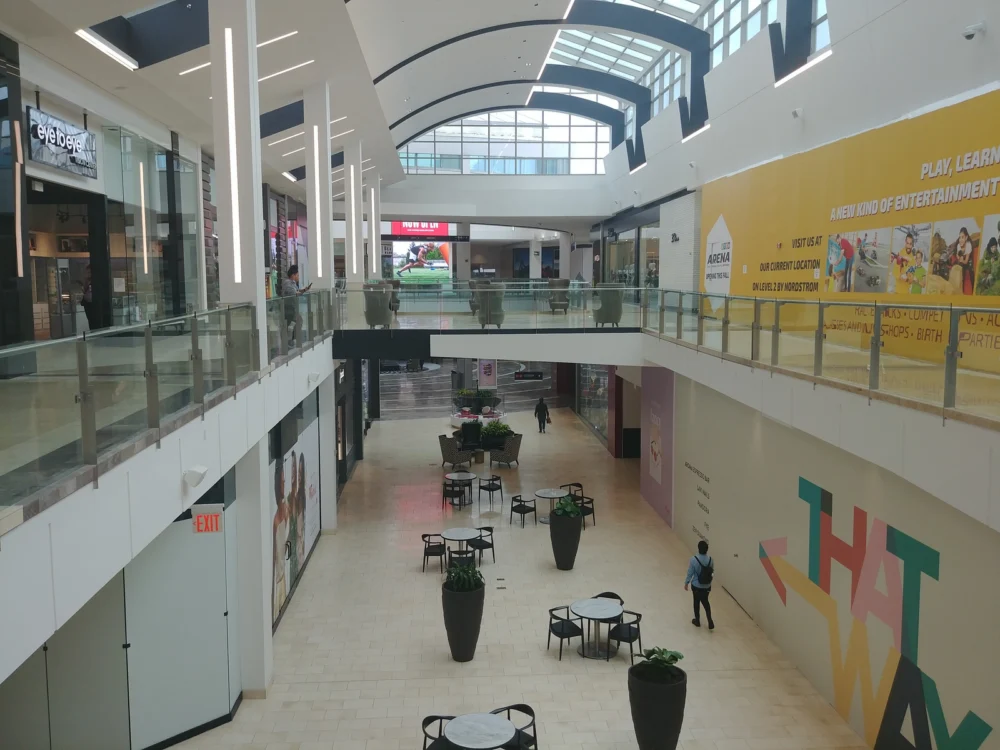 Few people strolling inside the Westfield Garden State Plaza Mall, one of the best malls in America, with few stores with banners and under construction