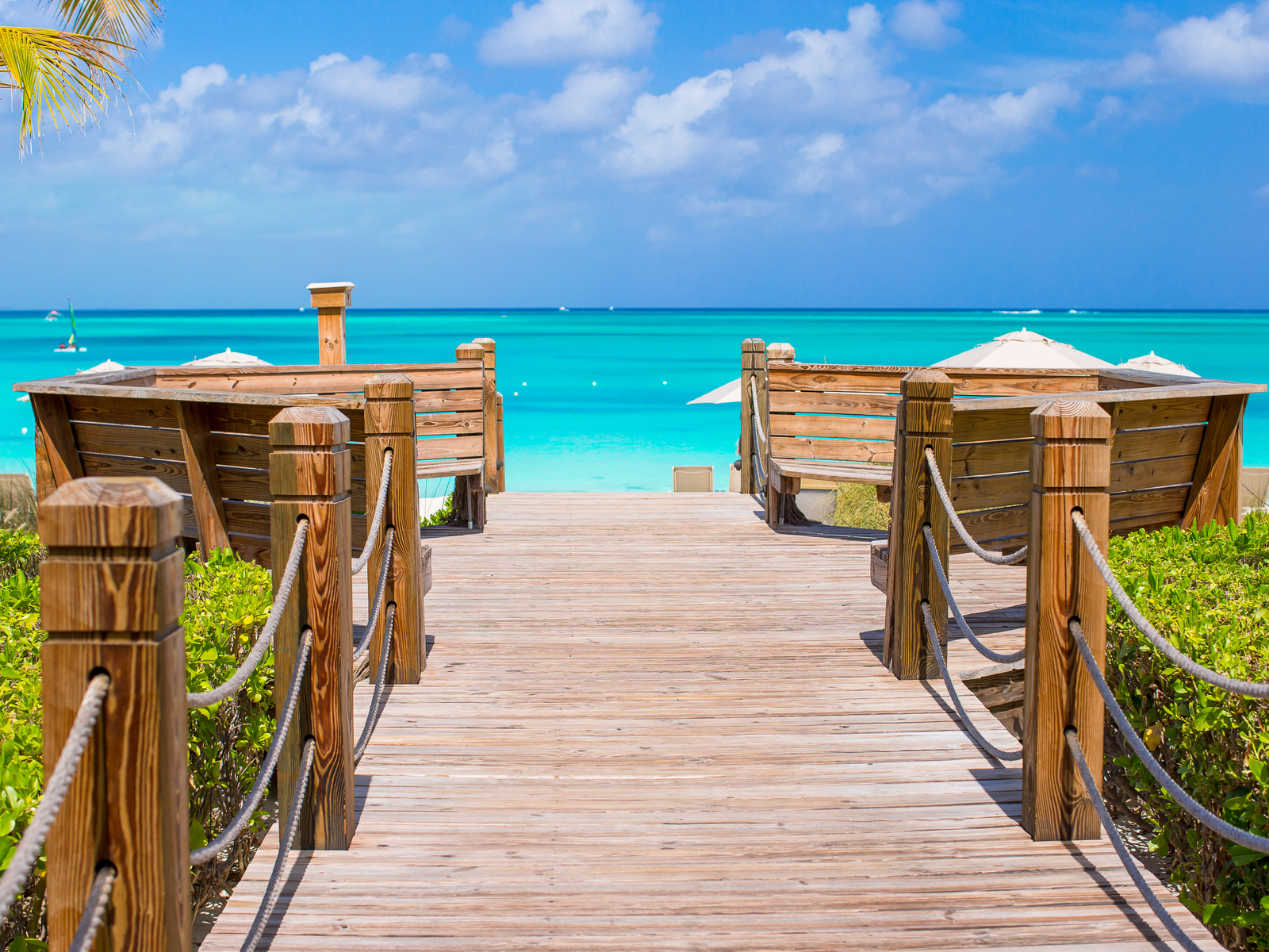 Gorgeous tropical island of Turks and Caicos during the best time to visit with a boat-looking dock