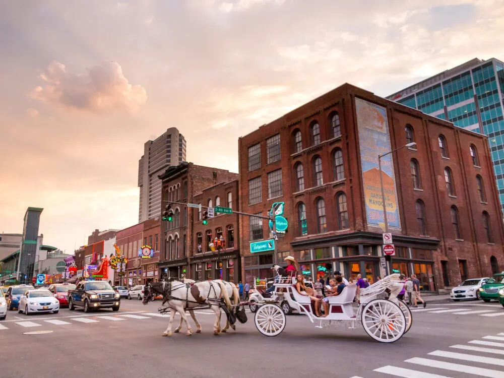 Horse drawn buggy pictured on the street during the cheapest time to visit Nashville