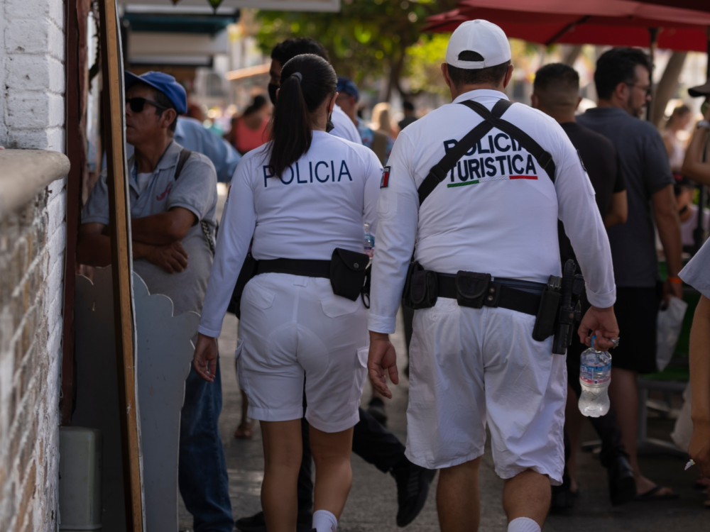 Mexican police patrolling the streets for a piece titled Is Puerto Vallarta Safe