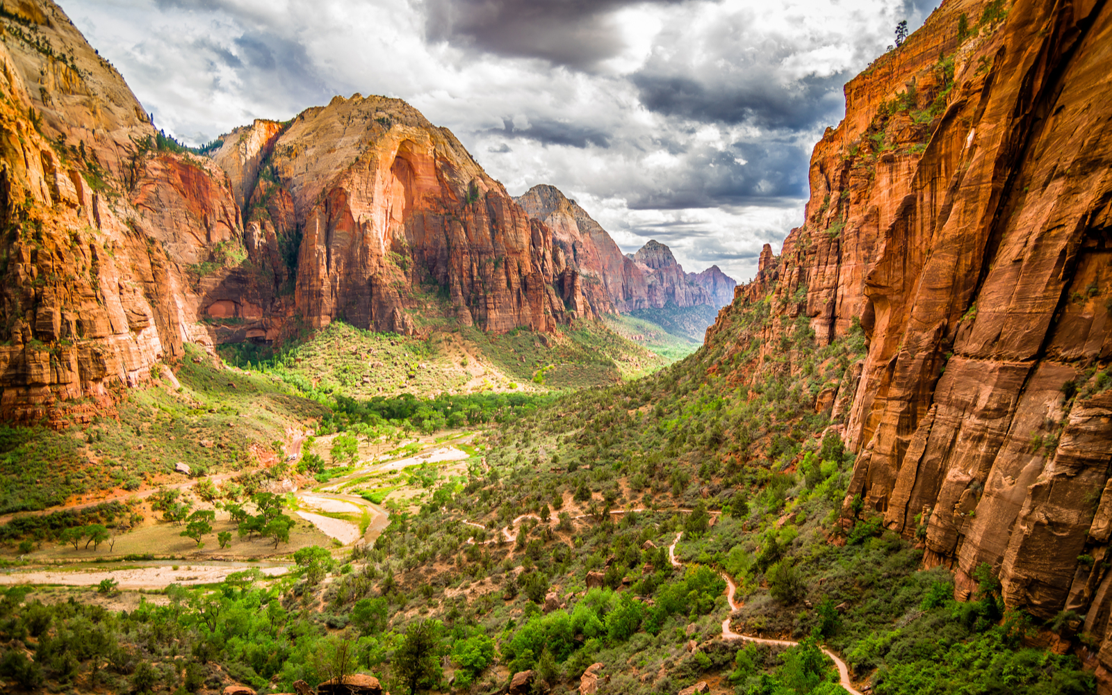 Colorful landscape of the red rocks and green valleys on a cloudy day during the best time to visit Zion National Park