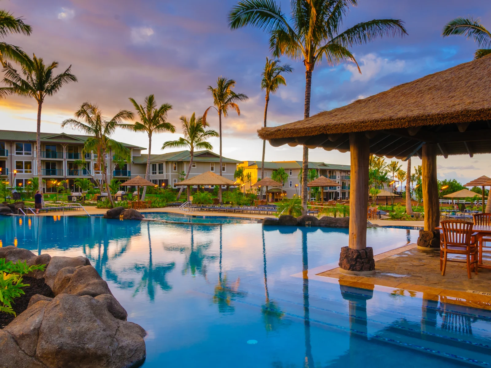 The Westin Resort pool and cabana at sunset in Princeville, a piece on the best hotels in Kauai