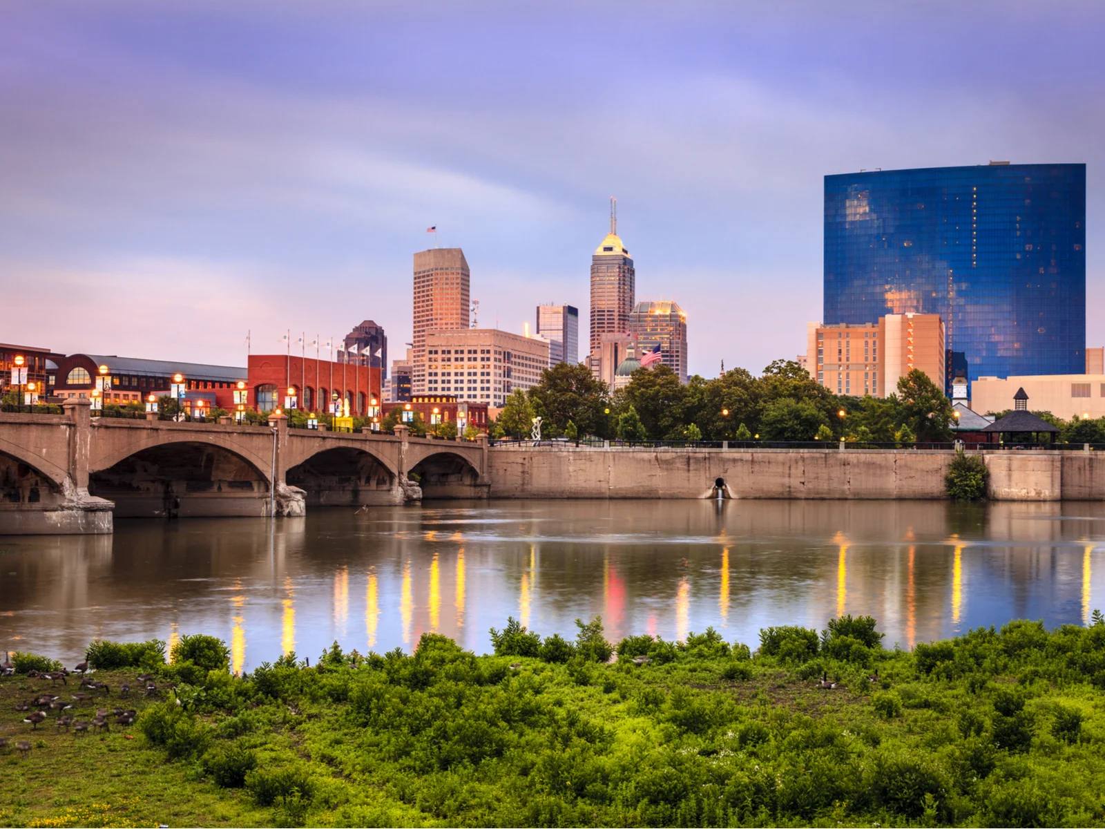 Indianapolis skyline pictured on the riverfront for a piece titled Is Indianapolis Safe to Visit