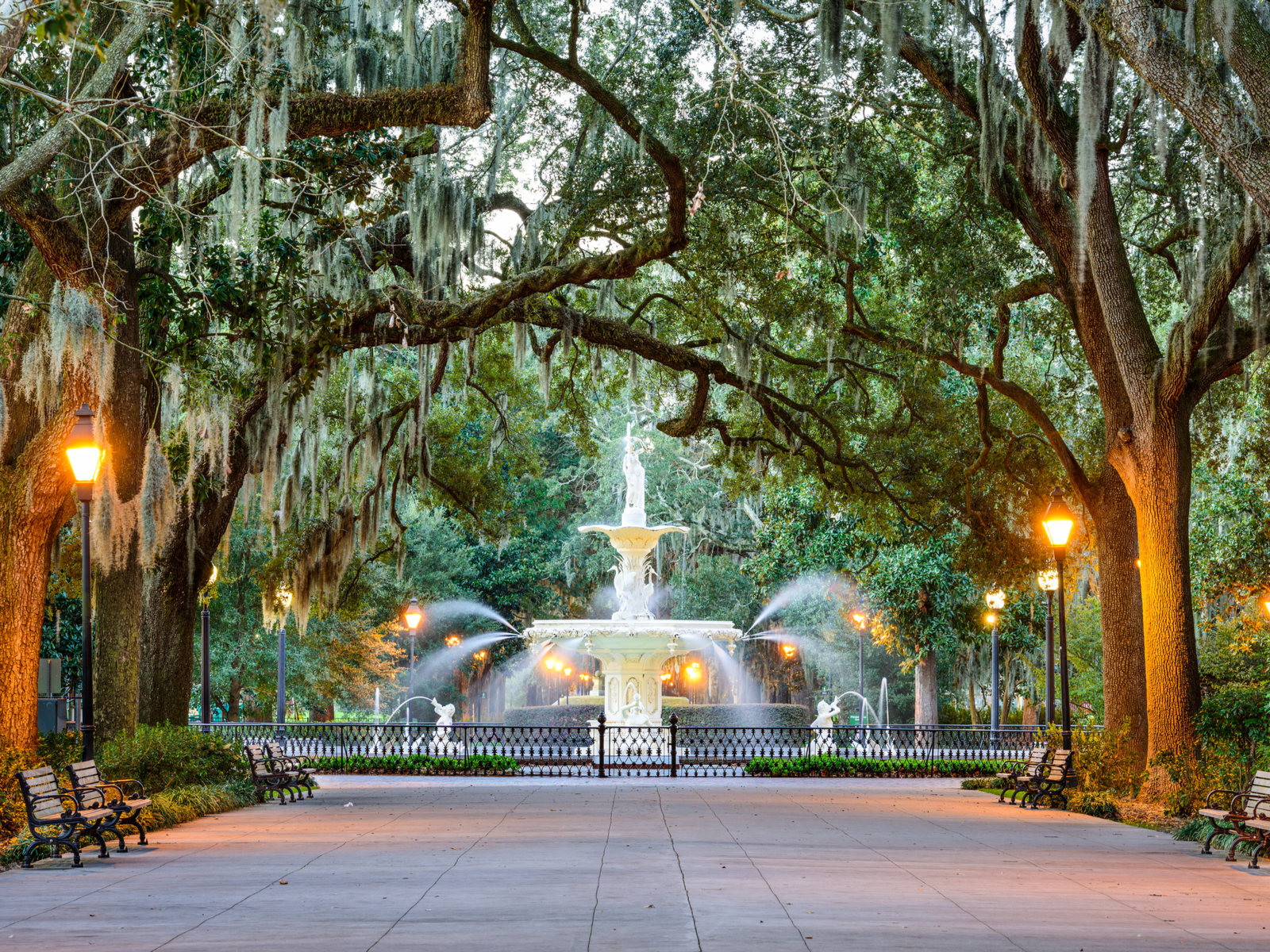 Forsyth park fountain pictured at dusk during the best time to visit Savannah Georgia