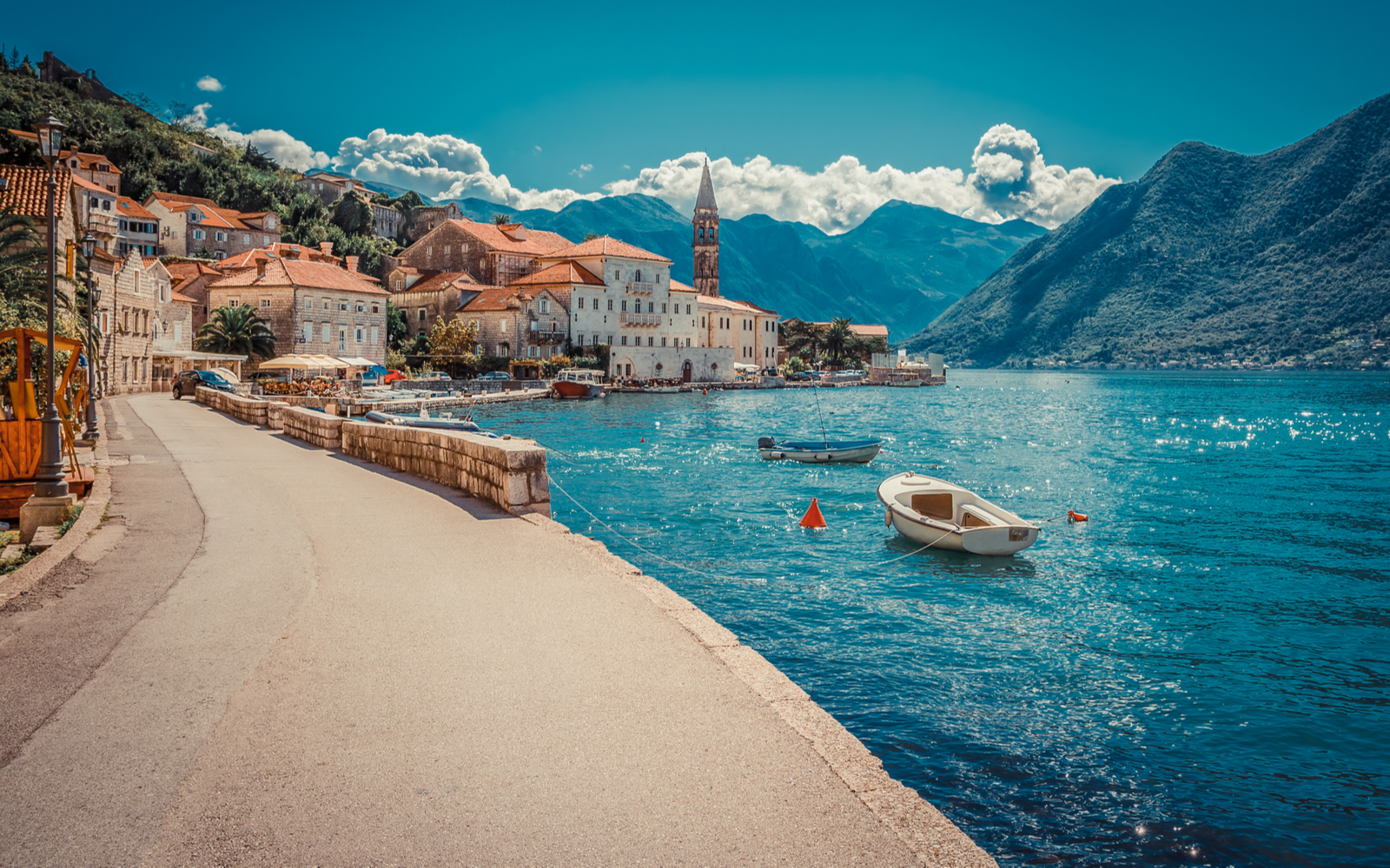 Harbor and boats in the Boka Kotor bay in Montenegro during the best time to visit Europe