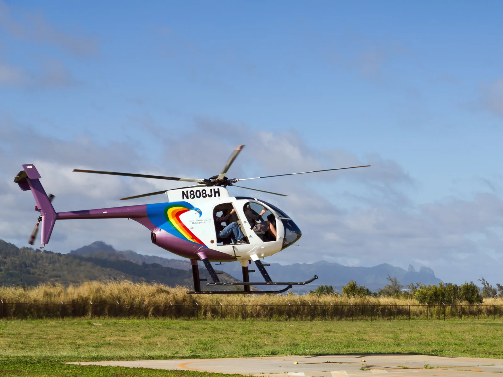 The small Jack Harter Helicopter is about to fly tourists across the island of Hawaii, considered one of the best things to do in Kauai