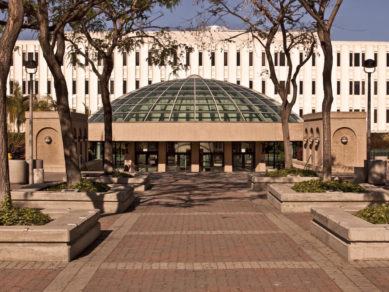 The large library at University of San Diego in California is one of the most beautiful college campuses with brick pathway leading towards the building