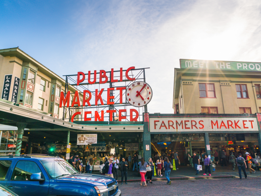 A busy afternoon at Pike Place Market or Public Market Center, one of the most iconic places in America, where customers come and go to buy at stores and stalls