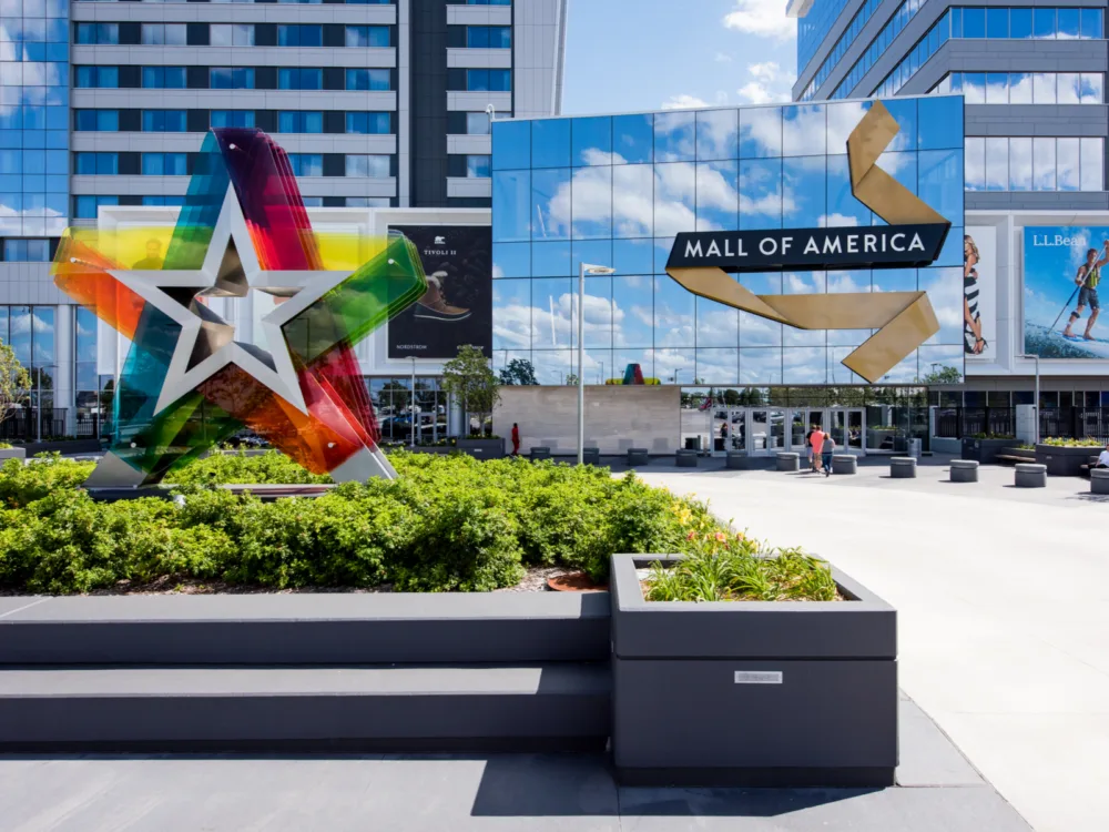 A multi-colored star monument in front of the entrance at the Mall of America, one of the most iconic places in America, with mirror shine exterior finish