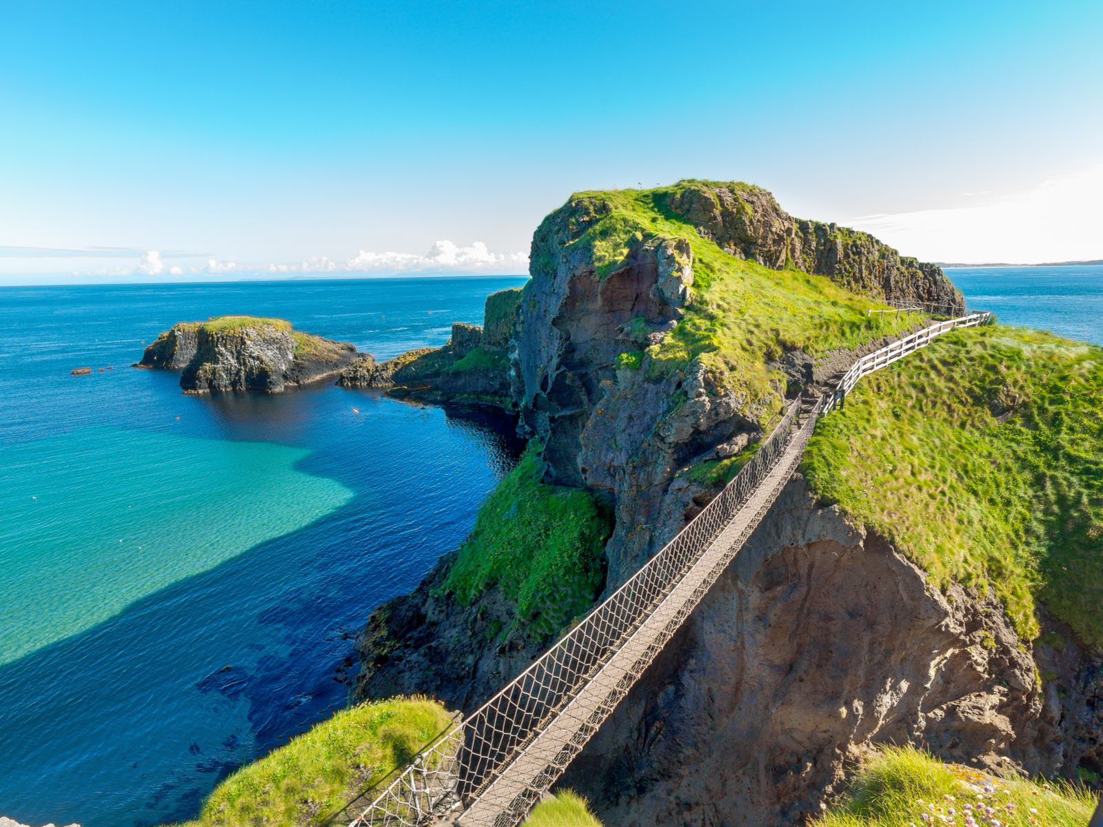 Rope bridge spanning the Carrick a Rede during the best time to visit Ireland