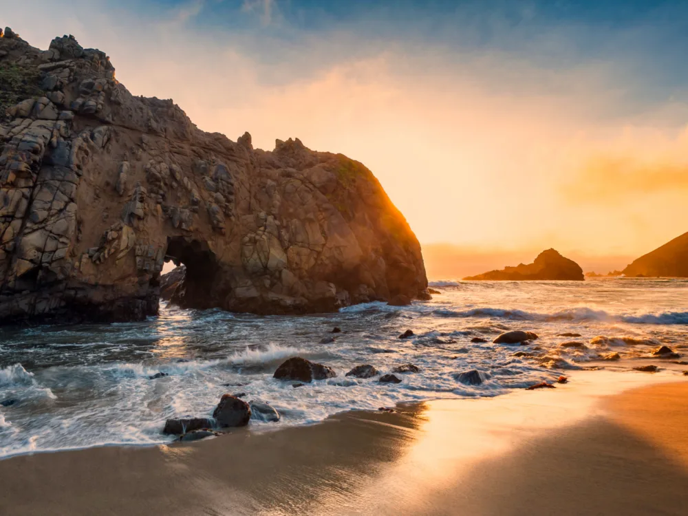 Beautiful sunset over Pfeiffer Beach a part of Bg Sur in California, named as one of the best beaches in the US, famous for its iconic rock formation by the sea