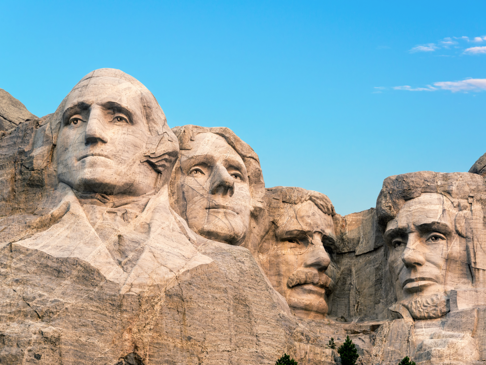 A gigantic sculpture on faces of the four famous US presidents on Mount Rushmore National Memorial in South Dakota, a piece on the most iconic places in America
